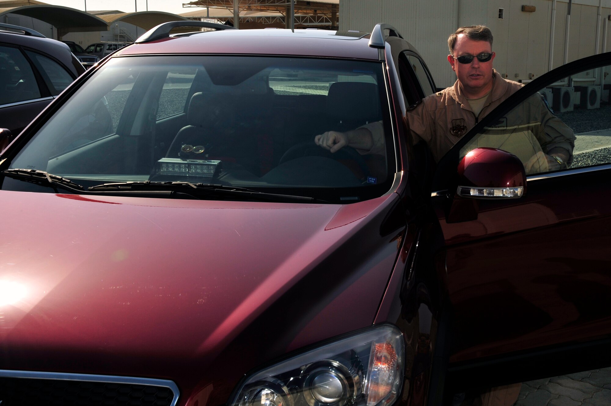 SOUTHWEST ASIA -Brig. Gen. Bryan Benson, 380th Air Expeditionary Wing commander, prepares to test drive his new staff vehicle Oct. 26, 2009. General Benson received the new vehicle to comply with new Department of Defense directives. (U.S. Air Force photo/Tech. Sgt. Charles Larkin Sr)