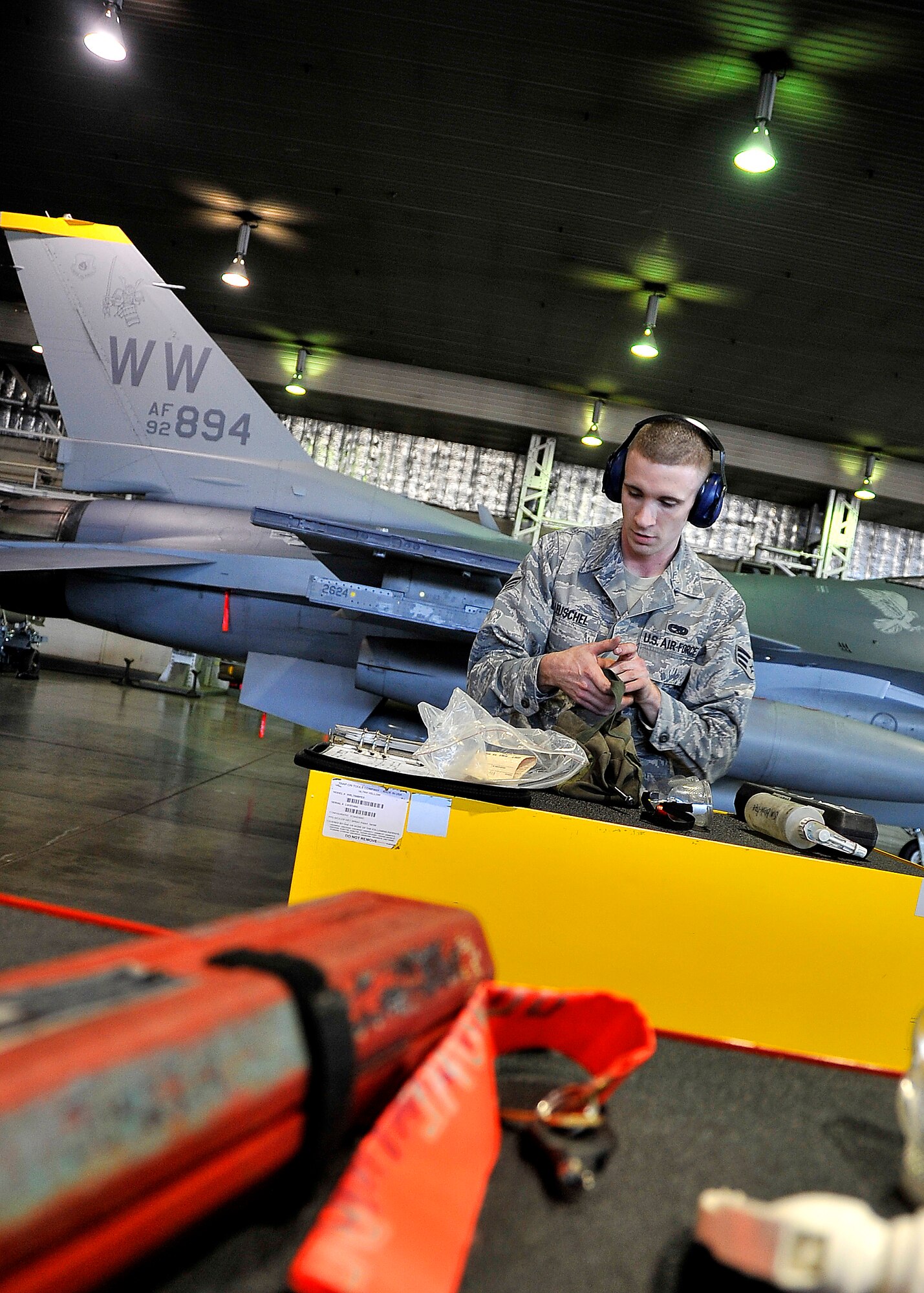 MISAWA AIR BASE, Japan -- Senior Airman Jesse Leuschel, 14th Aircraft Maintenance Unit weapons specialist, cleans a workbench during the weapons load crew competition Oct. 23. Airman Leuschel's job during the competition was to prepare to the aircraft before his team loaded munitions. (U.S. Air Force photo/Staff Sgt. Chad C. Strohmeyer).