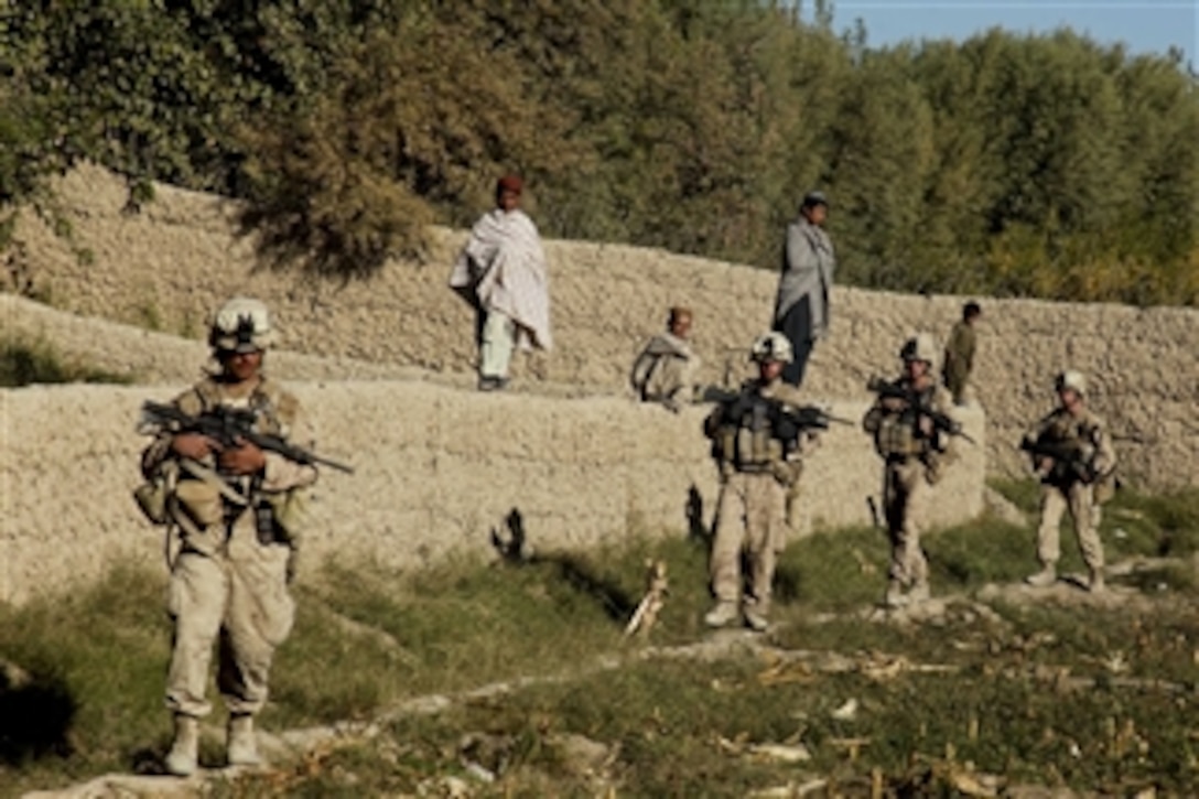 U.S. Marines with Bravo Company, 1st Battalion, 5th Marine Regiment conduct a security patrol through the Nawa district of Helmand province, Afghanistan, on Oct. 18, 2009.  Marines conduct security patrols to decrease insurgent activity and gain the trust of the Afghan people.  The Marines are deployed with Regimental Combat Team 3 to conduct counterinsurgency operations with Afghan National Security Forces in southern Afghanistan.  