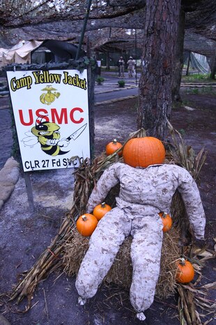 MARINE CORPS BASE CAMP LEJEUNE, N.C. - Food Service Company, Combat Logistics Regiment 27, 2nd Marine Logistics Group established field mess Camp Yellow Jacket in July.  Marines with the company have set up a scarecrow in the desert digital utility uniform to prepare for the season's holidays.