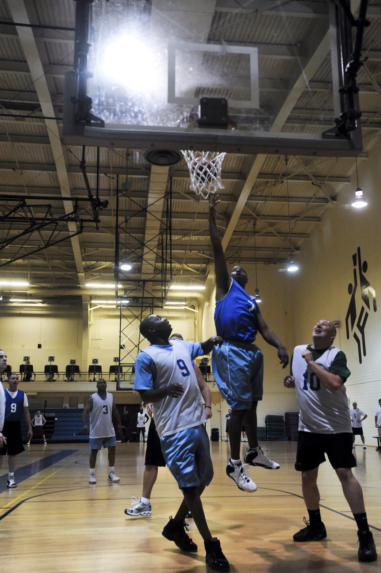 ELMENDORF AIR FORCE BASE, Alaska -- A player from the 3rd Force Support Squadron makes a layup to tie the game during overtime. The game was won in overtime by the 3rd Equipment Maintenance Squadron. (U.S. Air Force photo/ Airman Jack Sanders)