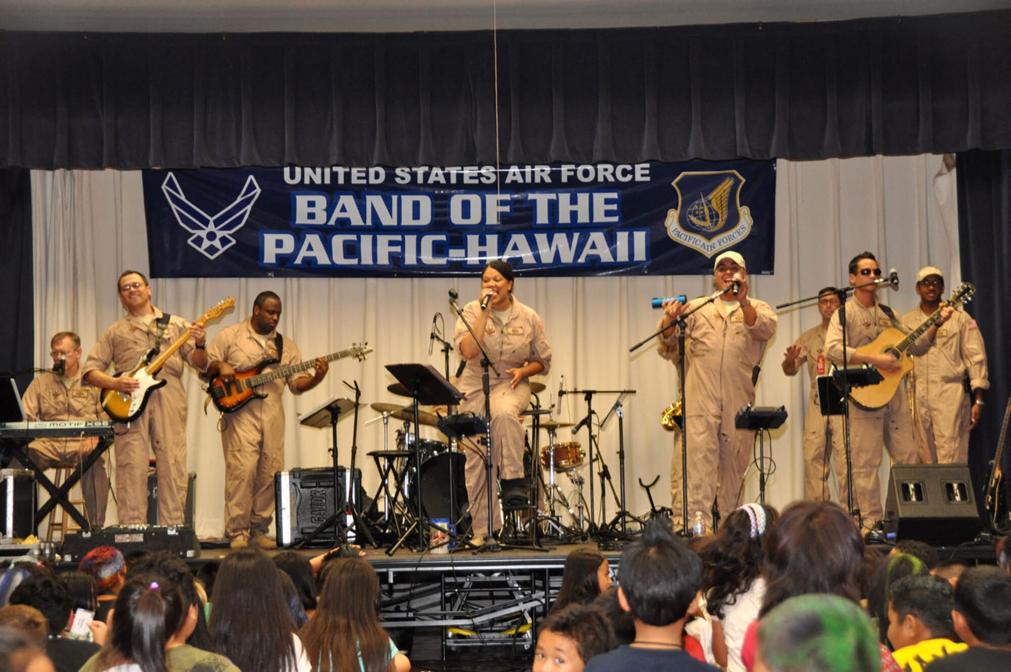 U. S. Air Force Band of the Pacific-Hawaii members perform at Kaleiopuu elementary School in Waipahu, Hawaii, Oct 22 as part of Red Ribbon Week which is a program aimed at reinforcing children's decisions to stay away from drugs and make positive decisions in life. (U.S.  Air Force photo/Tech. Sgt. Cohen A. Young)