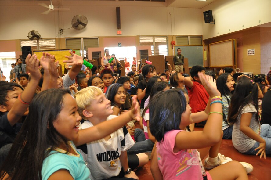 Students at Kaleipuu Elementary School react to a performance by the U. S. Air Force Band of the Pacific-Hawaii Oct. 22 in Waipahu, Hawaii. The performance was part of Red Ribbon Week, a program aimed at reinforcing children's decisions to stay away from drugs and make positive decisions in life. (U.S.  Air Force photo/Tech. Sgt. Cohen A. Young)