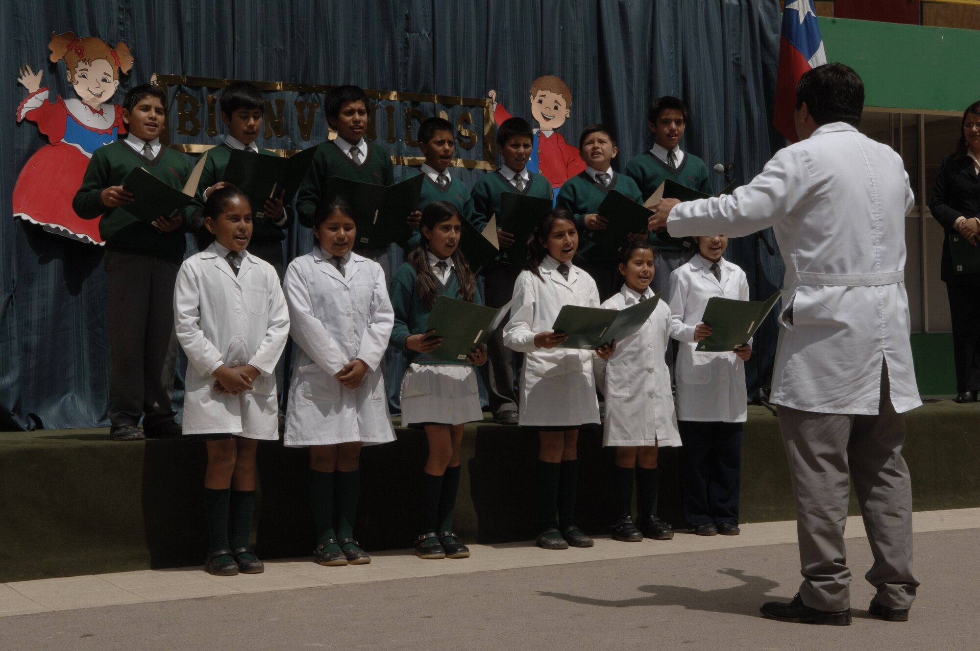 IQUIQUE, Chile -- Students of Colegio Macaya in Alto Hospicia, Chile perform a song Oct. 27 as part of a welcoming ceremony for visiting U.S. and Chilean Airmen.  (U.S. Air Force photo by Tech. Sgt. Eric Petosky)