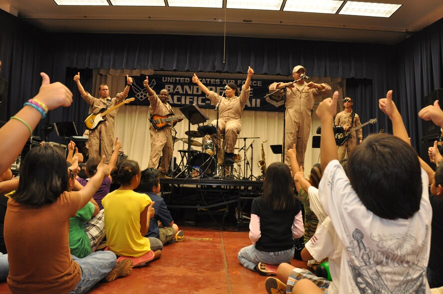 U. S. Air Force Band of the Pacific-Hawaii members perform for grades 3-6 at Kaleiopuu Elementary School in Waipahu, Hawaii, Oct 22 as part of Red Ribbon Week which is a program aimed at reinforcing children's decisions to stay away from drugs and make positive decisions in life. (U.S.  Air Force photo/Tech. Sgt. Cohen A. Young)