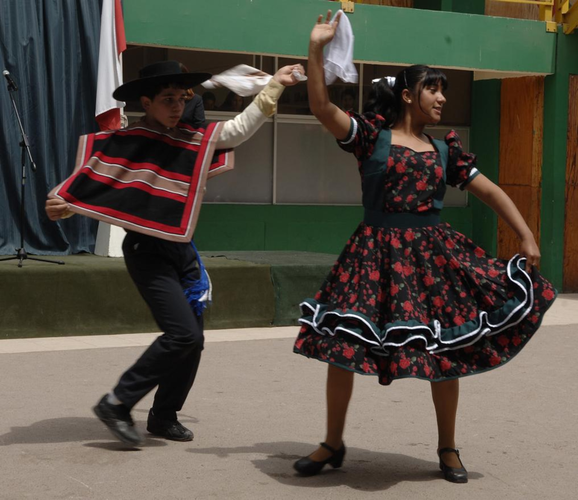 IQUIQUE, Chile -- Students of Colegio Macaya in Alto Hospicia, Chile perform a traditional dance recital Oct. 27 as part of a welcoming ceremony for visiting U.S. and Chilean Airmen.  (U.S. Air Force photo by Tech. Sgt. Eric Petosky)