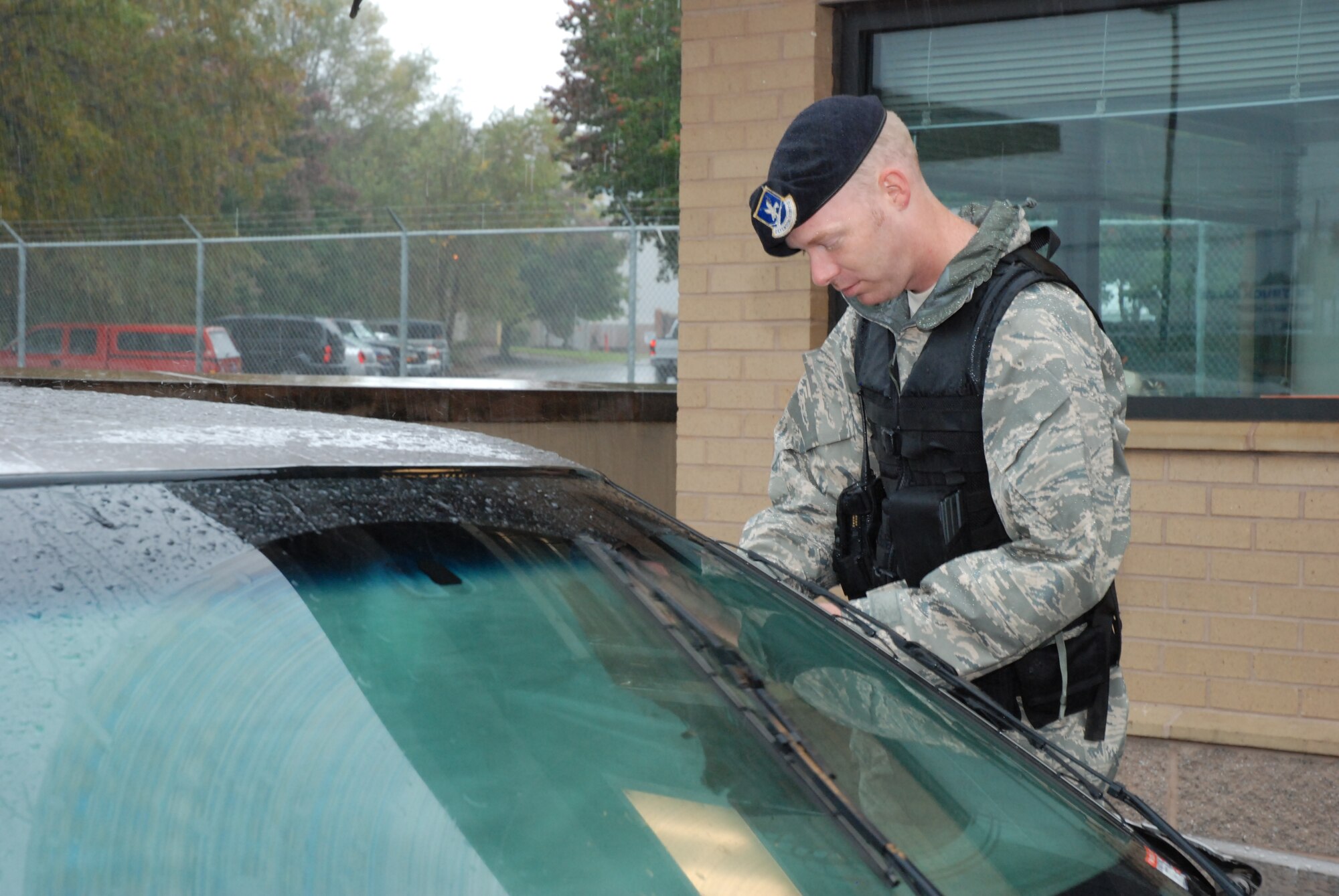 Staff Sgt. Thomas Smith, 94th Security Forces Squadron fire team member, ensures the first layer of security at the front gate of Dobbins Air Reserve Base, Ga. Oct. 27 during a rainy day. Sergeant Smith and his fellow team members perform their security duties in all weather conditions.  (U.S. Air Force photo/Master Sgt. Stan Coleman)