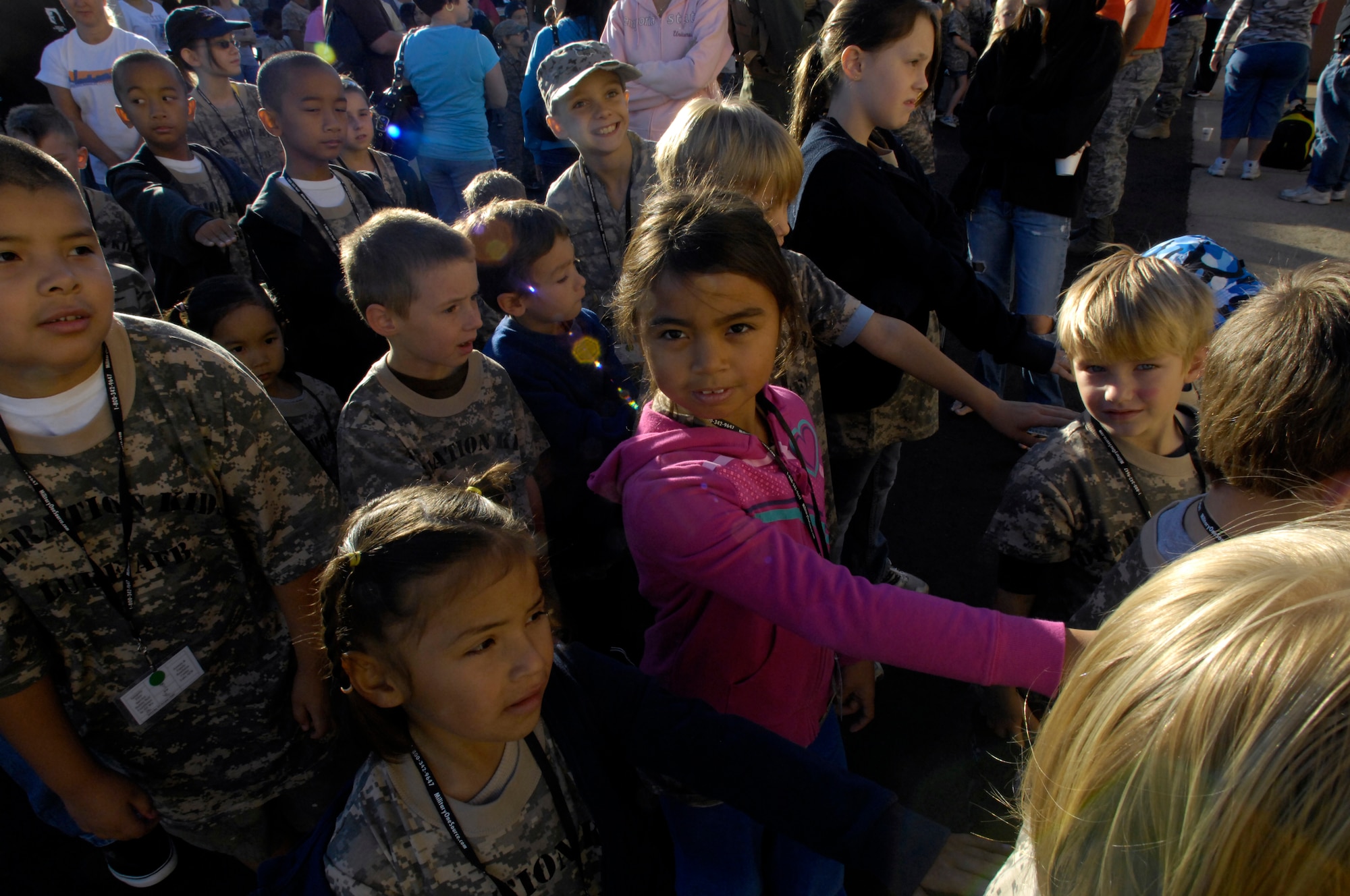 Children "form up" before entering a hanger to receive a mission brief while participating in the 2009 Operation Kids event, Oct. 24, 2009, Luke Air Force Base, Arizona. (U.S. Air Force Photo by Staff Sgt. Jason Colbert)