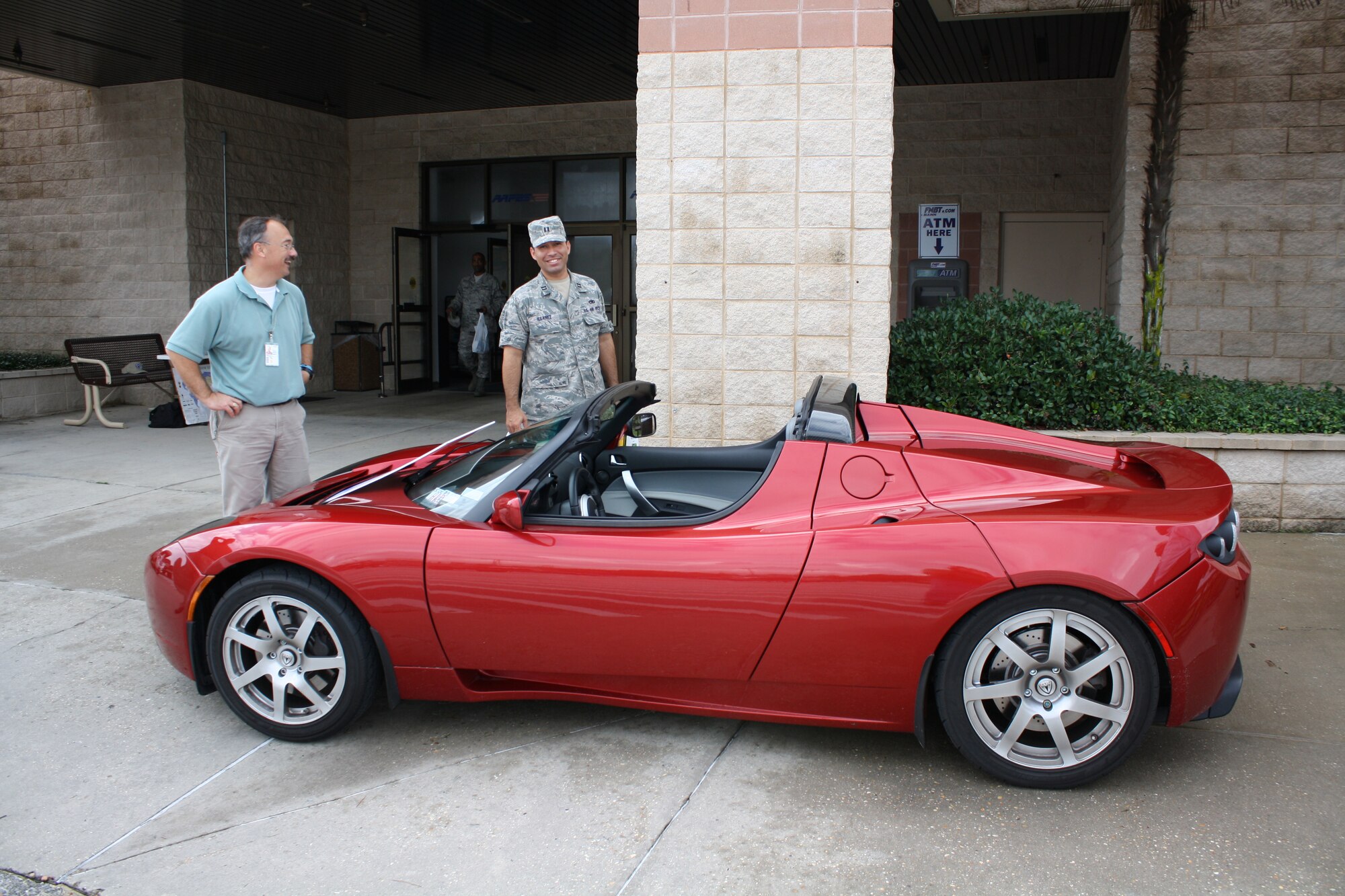The all-electric Tesla Roadster sits on display Oct. 15 at the Hurlburt
Field Base Exchange. The car was on display as part of an event to recognize
October as Energy Awareness Month. (photo courtesy of Marc Barrett)
