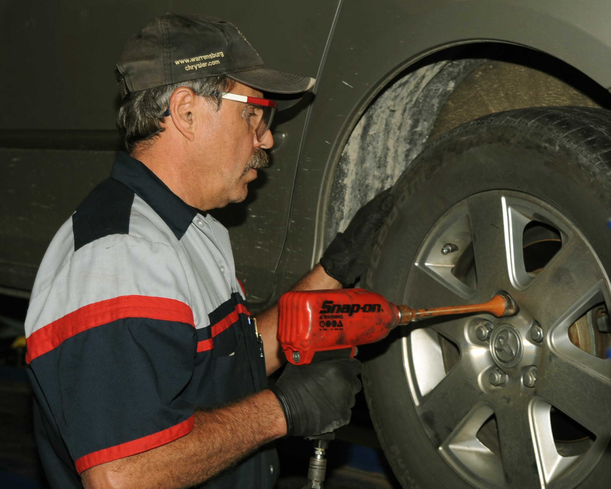 WHITEMAN AIR FORCE BASE, Mo., - Rafael Ramirez, Whiteman Auto Hobby Shop service manager , torques the wheels of a customer's Toyota after balancing the tires.  Whiteman Airmen can stretch their dollars further by utilizing the auto hobby shop according to Mr. Ramirez. The shop can help save Airmen 40 to 60 percent over dealerships, he said. (Released) 