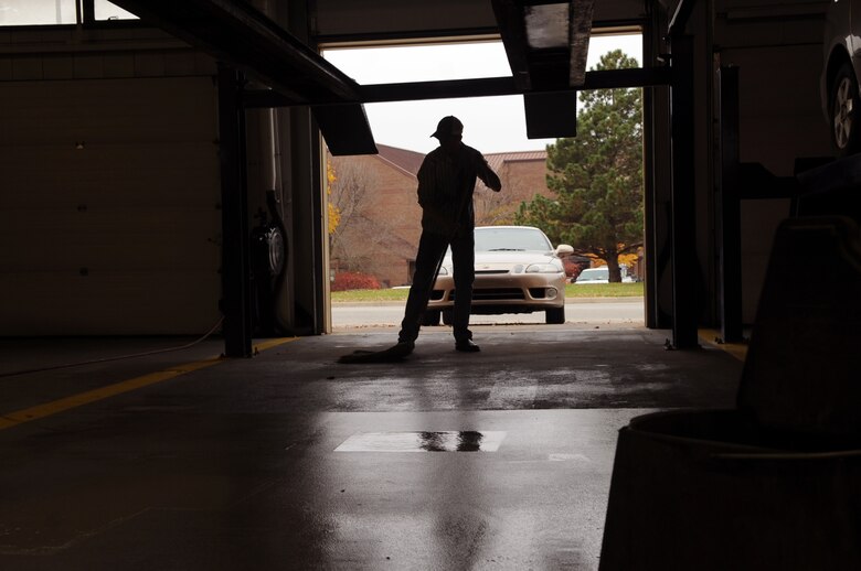 WHITEMAN AIR FORCE BASE, Mo., - Airman 1st Class Phillip Holmes, 19th Munitions Squadron, cleans up his area in the Whiteman Auto Hobby Shop after changing the transmission fluid and filter in his vehicle. Whiteman Airmen rent one of more than five areas to perform self-help projects on their vehicles.
(U.S. Air Force photo/Airman 1st Class Torey Griffith)(Released) 