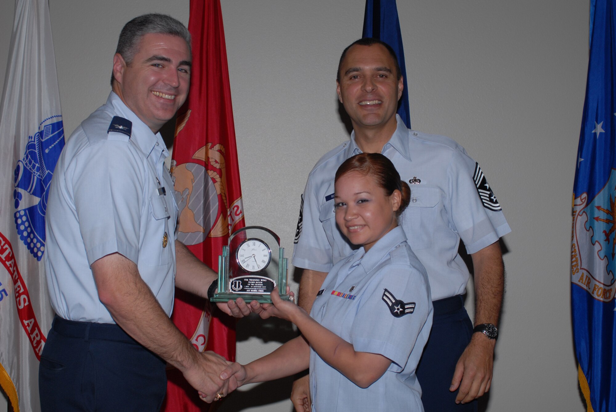 GOODFELLOW AIR FORCE BASE, Texas -- Airman 1st Class Isabel Cruz, 17th Medical Group, receives 17th Training Wing Dorm Room of the Quarter during the wing quarterly award ceremony, Oct. 26, 2009. (U.S. Air Force photo/Staff Sgt. Laura R. McFarlane)
