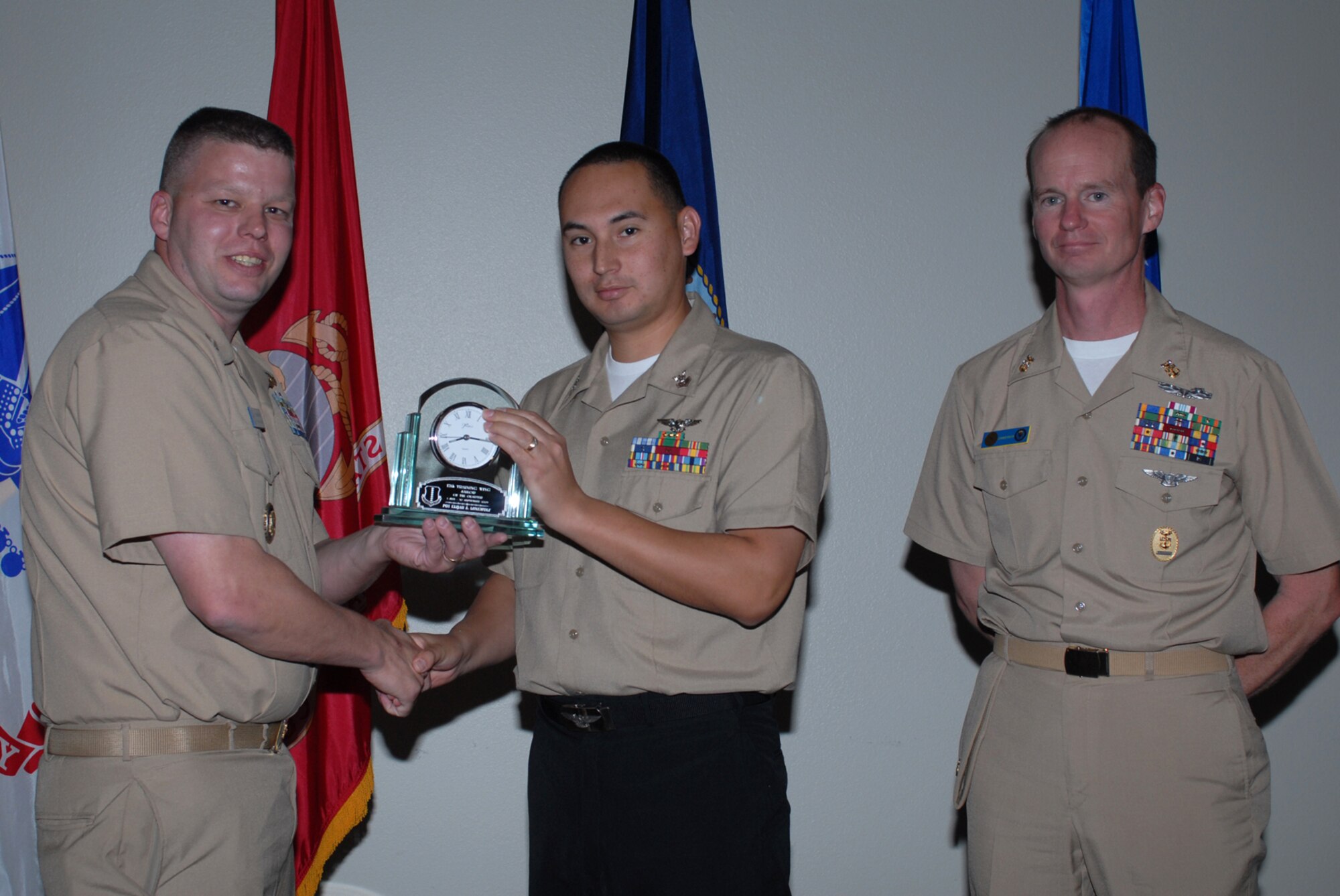 GOODFELLOW AIR FORCE BASE, Texas -- Navy Petty Officer 1st Class Elijah Lonewolf, Center for Information Dominance Detachment, receives 17th Training Wing Sailor of the Quarter during the wing quarterly award ceremony, Oct. 26, 2009. (U.S. Air Force photo illustration/Staff Sgt. Laura R. McFarlane)
