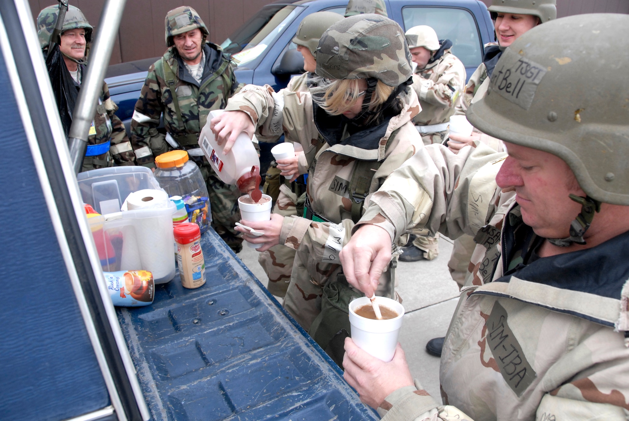Citizen Airmen from the 442nd Fighter Wing enjoy warm beverages and treats provided by the wing's first sergeants who delivered the morale boosters to numerous locations in the midst of the October 2009 operational readiness inspection at Whiteman Air Force Base, Mo. (U.S. Air Force photo/Staff Sgt. Kent L. Kagarise)