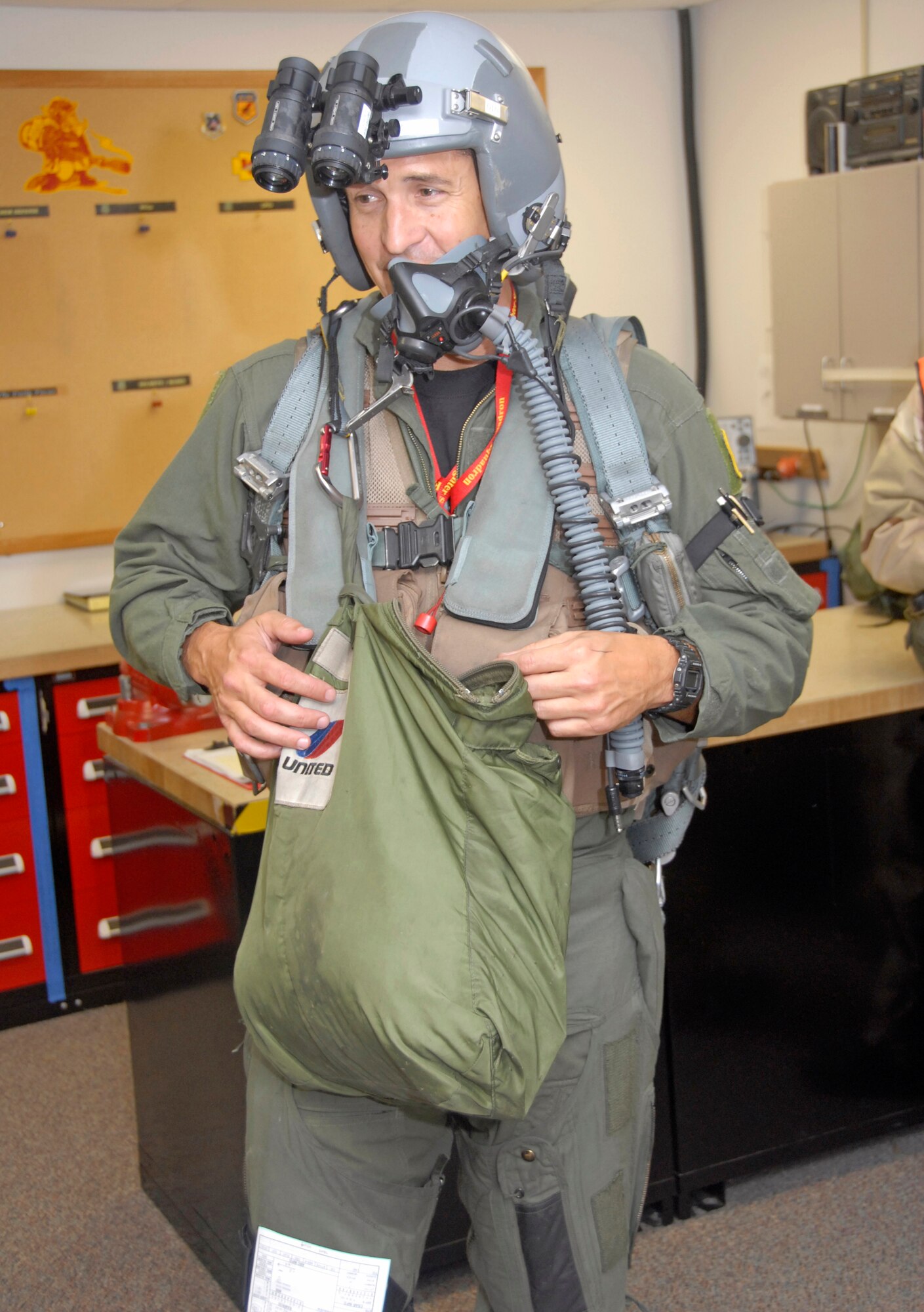 Lt. Col. Mike Bever, an A-10 Thunderbolt II pilot in the 303rd Fighter Squadron, heads to the flightline with a positive mental attitude during the 442nd Fighter Wing's October 2009 operational readiness inspection at Whiteman Air Force Base Mo. (U.S. Air Force photo/Staff Sgt. Kent L. Kagarise)
