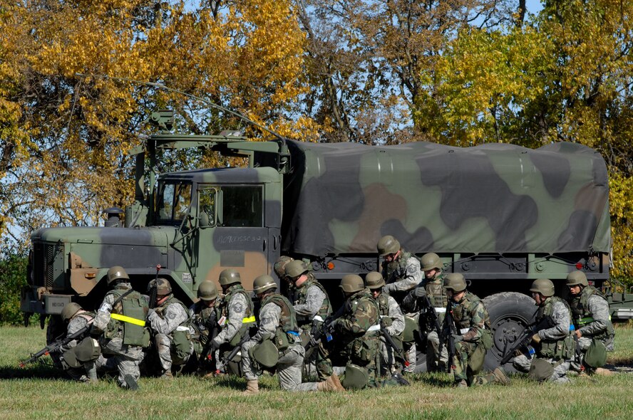Members of the 442nd Mission Support Group prepare to defend their convoy during an operational readiness inspection field exercise Oct. 24 at Whiteman Air Force Base, Mo.  Citizen Airmen from the 442nd Mission Support Group operated from an austere location, known as "Camp Rock" during the two-day field-training portion of the inspection.  The group is part of the 442nd Fighter Wing, an Air Force Reserve unit based at Whiteman.  An inspector general team from Headquarters Air Combat Command arrived at Whiteman Oct. 23 and is expected to deliver a report on the wing's performance Oct. 29.  (U.S. Air Force photo/Senior Airman Kenny Holston)