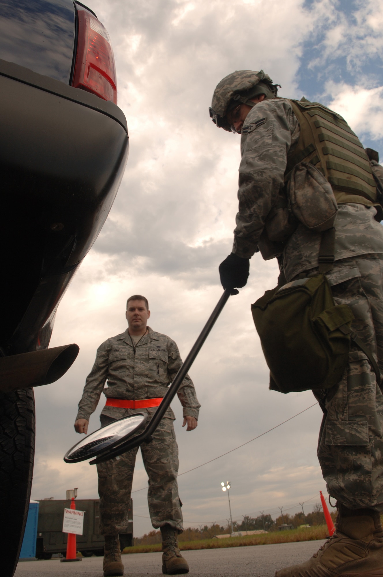 WHITEMAN AIR FORCE BASE, Mo. - Airman 1st Class Richard Hovland, 509th Security Forces, inspects a vehicle during the base Nuclear Operational Readiness Inspection Oct. 16. Whiteman Air Force Base received an excellent during the NORI, a higher-headquarters inspection that evaluated the 509th Bomb Wing's capability to conduct nuclear operations.  (U.S. Air Force photo/Senior Airman Jessica Snow)(Released) 