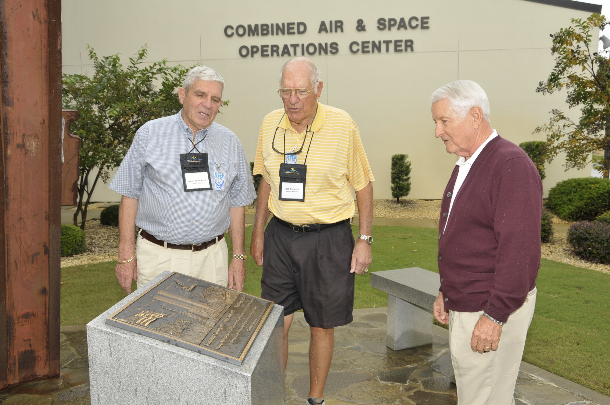 Lt. Col. (ret.) A.J. Kelly, Lt. Col. (ret.) Bob Reimers and Maj. Gen. (ret.) Bob Taylor view a plaque that is part of the Sept. 11, 2001, memorial at 1st Air Force’s 601st Air and Space Operations Center. The retired fighter pilots were among more than 100 alumni of the former Air Defense Weapons Center who regularly attend biennial reunions in the Tyndall AFB, Fla., area. (U.S. Air Force photo by Lisa Norman.)