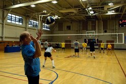 Dustin Brisson serves the ball during the Charleston AFB intramural volleyball championship game between the 437th Operations Group/Operations Support Squadron Flyers and the 437th Aerial Port Squadron at the Fitness and Sports Center here Oct. 22. The volleyball season began Aug. 25, lasted nine weeks and ended with a championship victory for the 437 APS. Brisson is a Web operations technician with the 437 OG. (U.S. Air Force photo/Staff Sgt. Daniel Bowles)