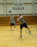 Bradley Lane returns the ball after a serve during the Charleston AFB intramural volleyball championship game at the Fitness and Sports Center here Oct. 22. The 437th Operations Group/Operations Support Squadron Flyers were undefeated in regular season play, going into the finals with a 11-0 record. Lane is a pilot with the 16th Airlift Squadron. (U.S. Air Force photo/Staff Sgt. Daniel Bowles)