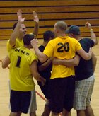 Members of the 437th Aerial Port Squadron volleyball team celebrate their win during the Charleston AFB intramural volleyball championship game at the Fitness and Sports Center here Oct. 22. After four years of playoff upsets, the 437 APS team placed second in the regular season and carried their momentum into a championship victory. (U.S. Air Force photo/Staff Sgt. Daniel Bowles)