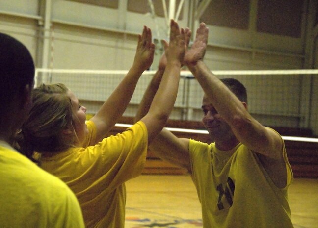 Brittany Thomforde and Robert Charest celebrate after winning the second match of the Charleston AFB intramural volleyball championship game at the Fitness and Sports Center here Oct. 22. After a difficult first match versus the 437th Operations Group/Operations Support Squadron Flyers, losing 14-25, the 437th Aerial Port Squadron positioned themselves for a comeback in the second match winning 25-21. Thomforde is a traffic management apprentice and Charest is a unit security manager, both are with the 437 APS. (U.S. Air Force photo/Staff Sgt. Daniel Bowles)