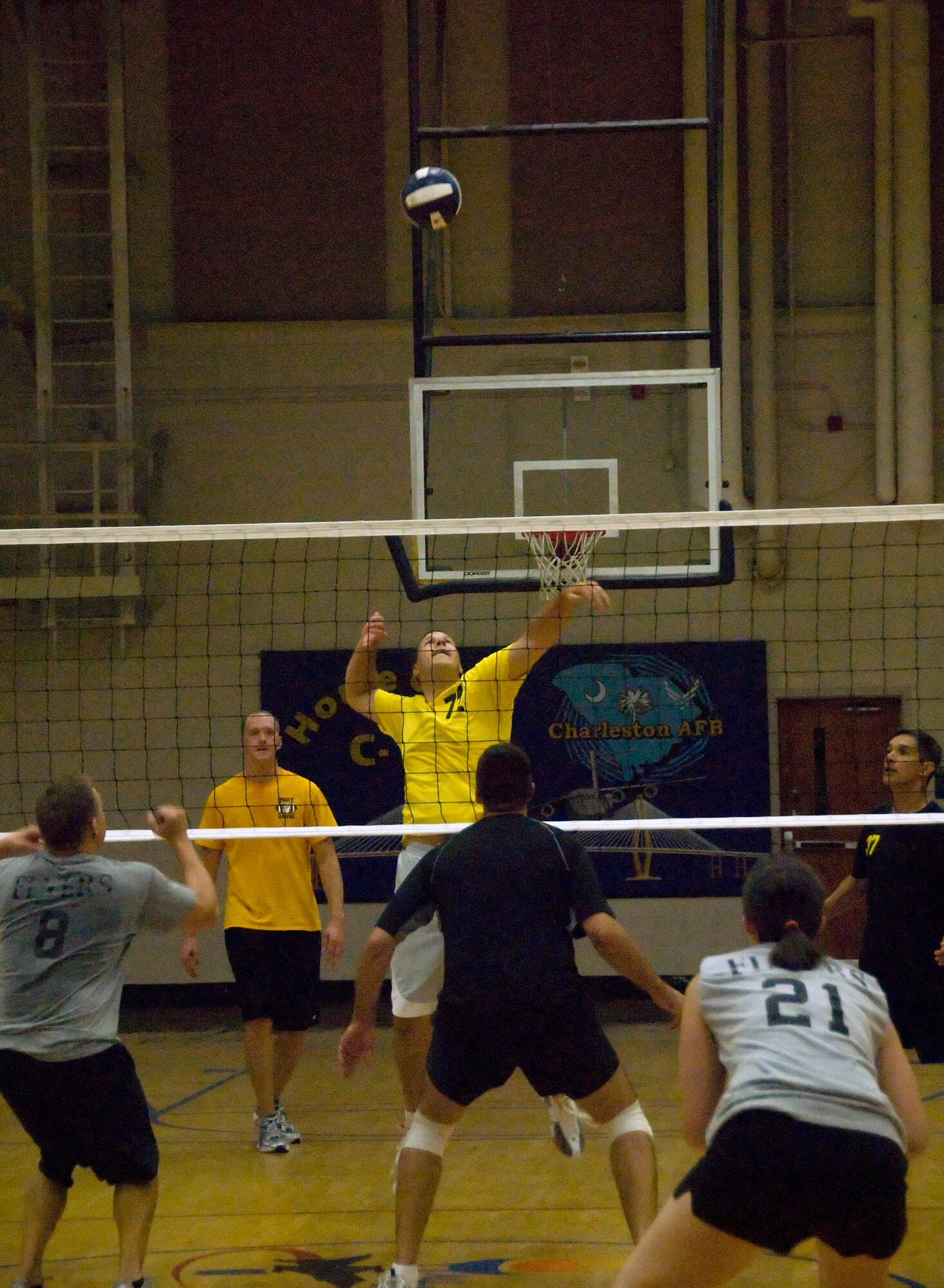 Michael Shaw leaps to land a spike on the ball during the Charleston AFB intramural volleyball championship game at the Fitness and Sports Center here Oct. 22. The 437th Aerial Port Squadron defeated the 437th Operations Group/Operations Support Squadron Flyers after a heated final match with a score of 15-11. Shaw is an air terminal operations center controller with the 437 APS.