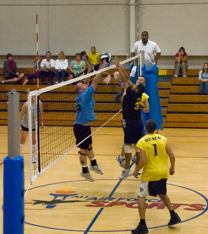 Members of the 437th Aerial Port Squadron and 437th Operations Group/Operations Support Squadron Flyers volleyball teams battle for control of the ball during the Charleston AFB intramural volleyball championship game at the Fitness and Sports Center here Oct. 22. The 437 APS won the game, souring the Flyers undefeated record. The 437 APS were named the base champions and the Flyers placed first in regular season play. (U.S. Air Force photo/Staff Sgt. Daniel Bowles)