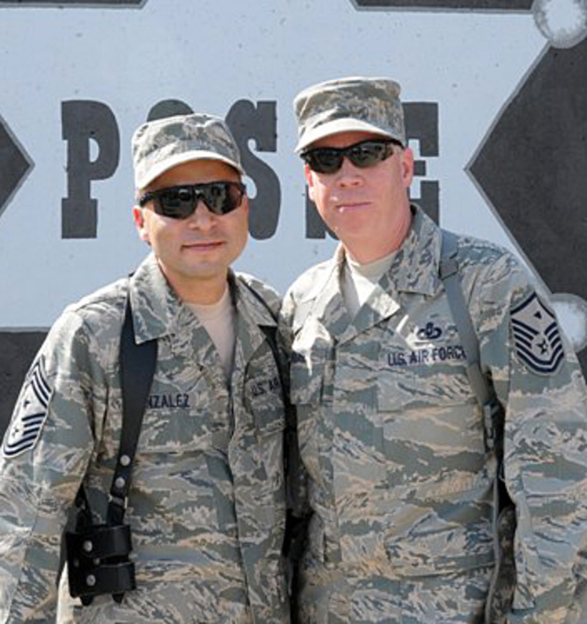 Chief Master Sgt. Ruben Gonzales, left, former 71st Flying Training Wing command chief, takes a moment to visit with Air Force Reserve Master Sgt. Tracy House, at Kirkuk Regional Air Base, Iraq. Chief Gonzales is deployed as the command chief with the Iraq Training and Advisory Mission-Air Force. Sergeant House is deployed as the 506th Expeditionary Logistics Readiness Squadron first sergeant at Kirkuk RAB. Sergeant House works as a government civilian with the Vance Housing Management Office when not deployed. (U.S. Air Force photo)