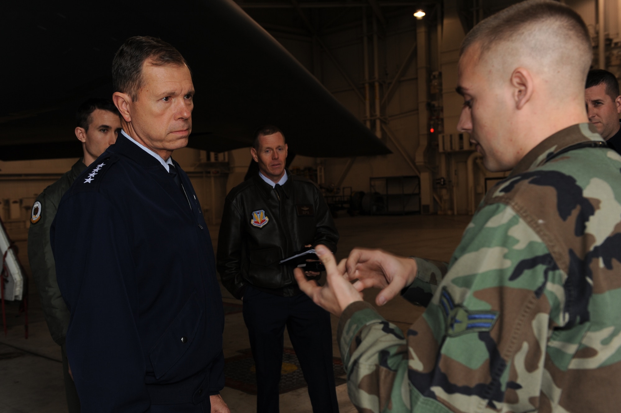 WHITEMAN AIR FORCE BASE, Mo. - Gen. William M. Fraser III, Air Combat Command commander, receives a briefing on the B-2 Spirit by Airman 1st Class Tim Kelly, 509th Aircraft Maintenance Squadron member, during his tour of the aircraft hanger, Oct. 26. General Fraser visited Whiteman Oct. 25 and 26 to observe the 498th Munitions Maintenance Group Activation ceremony and to visit local base agencies. (U.S. Air Force photo/Airman First Class Carlin Leslie)(Released) 