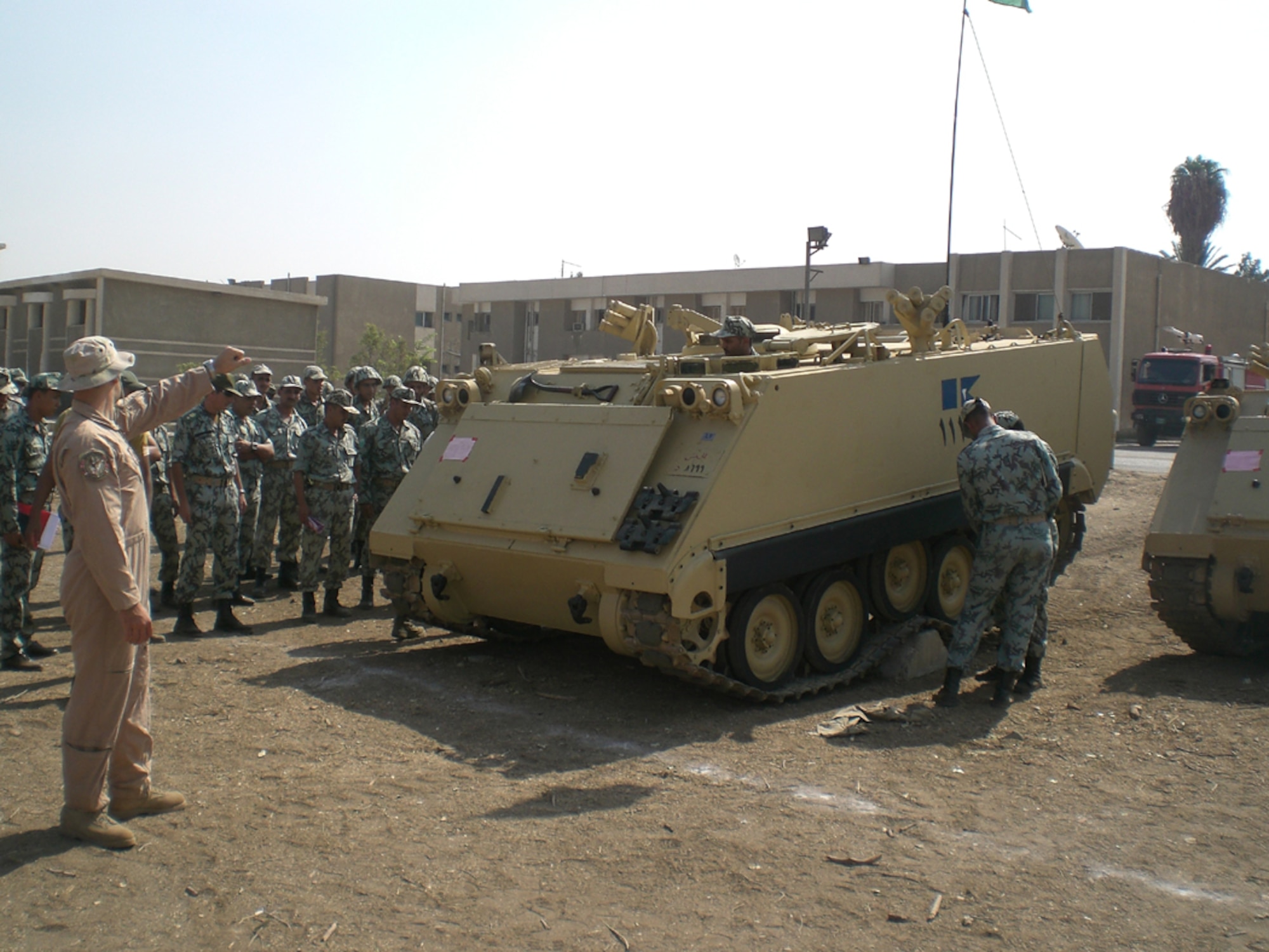 Tech. Sgt. John Rickenbach assists Egyptian Airborne soldiers with the simulated loading of an M-113 armored personnel carrier during BRIGHT STAR 09 in Cairo, Egypt, Oct. 9-21. The training course taught students how to load plan and prepare Egyptian cargo for transportation on-board American C-17 aircraft. (U.S. Air Force photo)