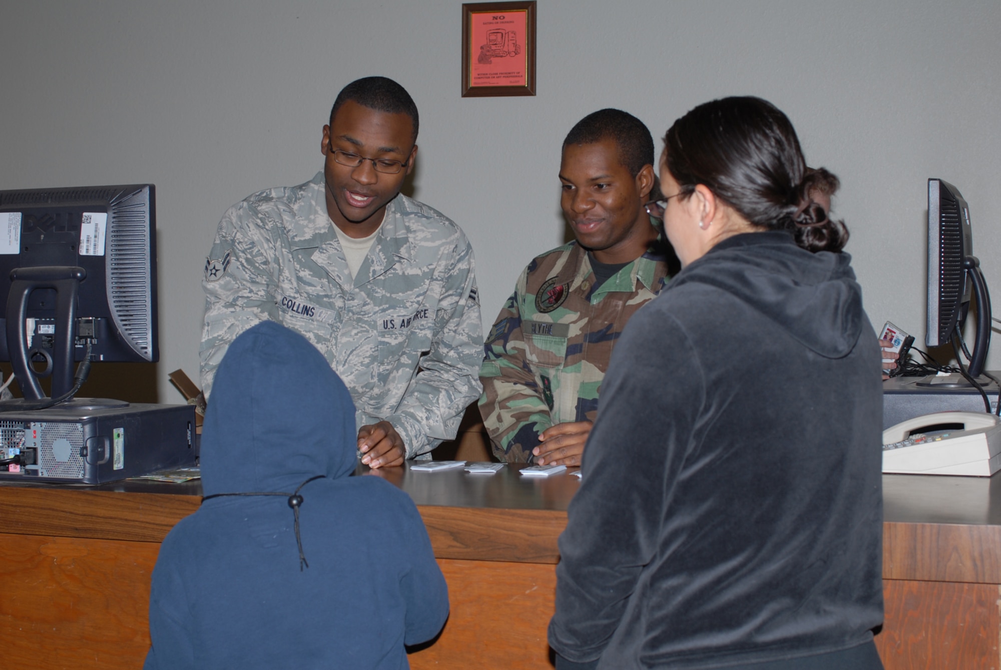 GOODFELLOW AIR FORCE BASE, Texas -- Airman 1st Class Demetrius Collins and Senior Airman Jonathan Blythe, both 17th Comptrollers Squadron, provide a finance brief to "deployees" during Operation Kids, Oct. 24, 2009. Operation Kids is a group of activities designed to increase dependents' understanding of the deployment process. (U.S. Air Force photo/Staff Sgt. Laura R. McFarlane)