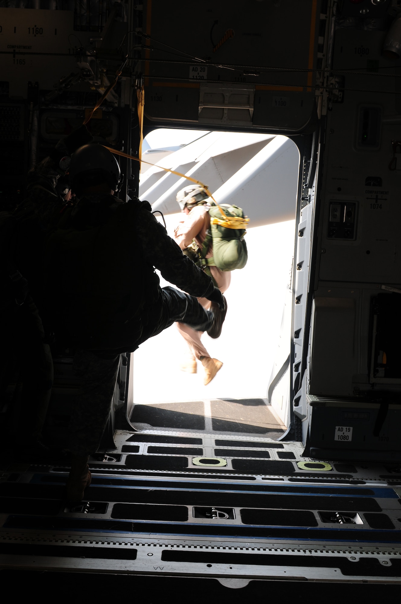 Tech. Sgt. John Gaona, jumpmaster during Cope India, executes a static jump out of a C-17 Globemaster III. Cope India is a United States and India airlift exercise that provides training for humanitarian assistance and disaster relief operations. (U.S. Air Force photo/ Capt. Genieve David) 
