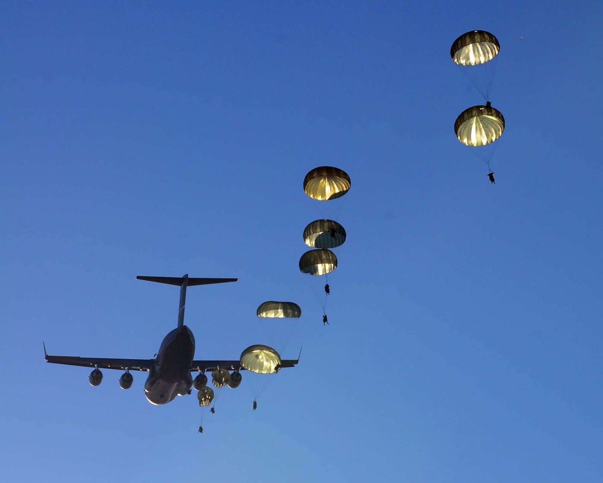 Paratroopers from the 1-325th Airborne Infantry Regiment jump from a C-17 aircraft during a strategic jump as part of Operation Bright Star 2009, a combined exercise including 11 countries and hosted by Egypt. Operation Bright Star is a biennial training exercise that promotes teambuilding and the sharing of expertise in a variety of areas among the participating countries. (U.S. Army photo/Sgt. 1st Class Craig L. Collins)