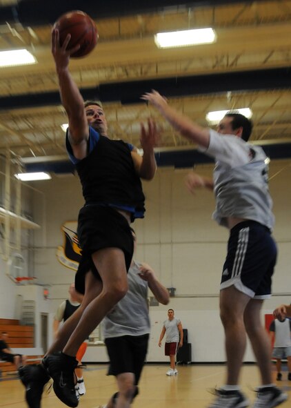 EGLIN AIR FORCE ASE, Fla. –  Robert Goddard with the 96th Security Forces Squadron jumps for the lay-up during the Over-30 Basketball tournament Oct. 26, against the Air Force Research Lab in the fitness center here. The AFRL team beat the 96th SFS team 37-22 followed by the 96th Civil Engineer Group’s one-point win over the 96th Contracting Squadron. Games are played Monday through Thursday at 11 a.m. and noon in the Eglin Fitness Center. (U.S. Air Force photo/ Airman Anthony Jennings)