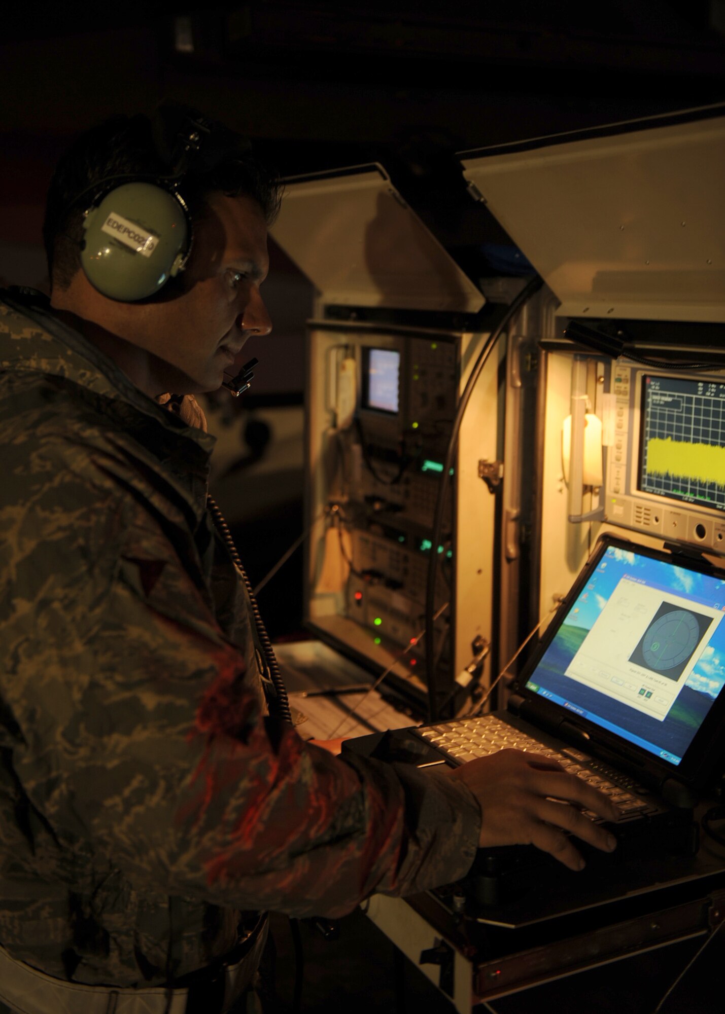 Tech Sgt. Edward Youmans, Combat Shield team member from Eglin Air Force Base, Fla., injects radio frequency signals into an F-15E Strike Eagle on Seymour Johnson Air Force Base, N.C., Oct. 20, 2009. Combat Shield began in 1999 and originated at Eglin Air Force Base, Fla. On average, the team visits up to 50 bases per year. (U.S. Air Force photo/Senior Airman Ciara Wymbs)  