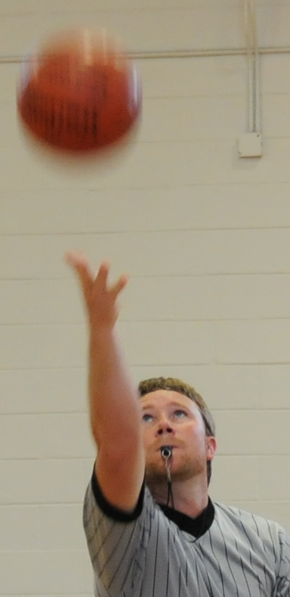 EGLIN AIR FORCE BASE, Fla. – A referee tosses the ball up for a jump ball during the Over-30 Basketball tournament Oct. 26, in the fitness center here. The Air Force Research Lab beat the 96th Security Forces Squadron 37-22 followed by the 96th Civil Engineer Group’s one-point win over the 96th Contracting Squadron. Games are played Monday through Thursday at 11 a.m. and noon in the Eglin Fitness Center. (U.S. Air Force photo/ Airman Anthony Jennings)
