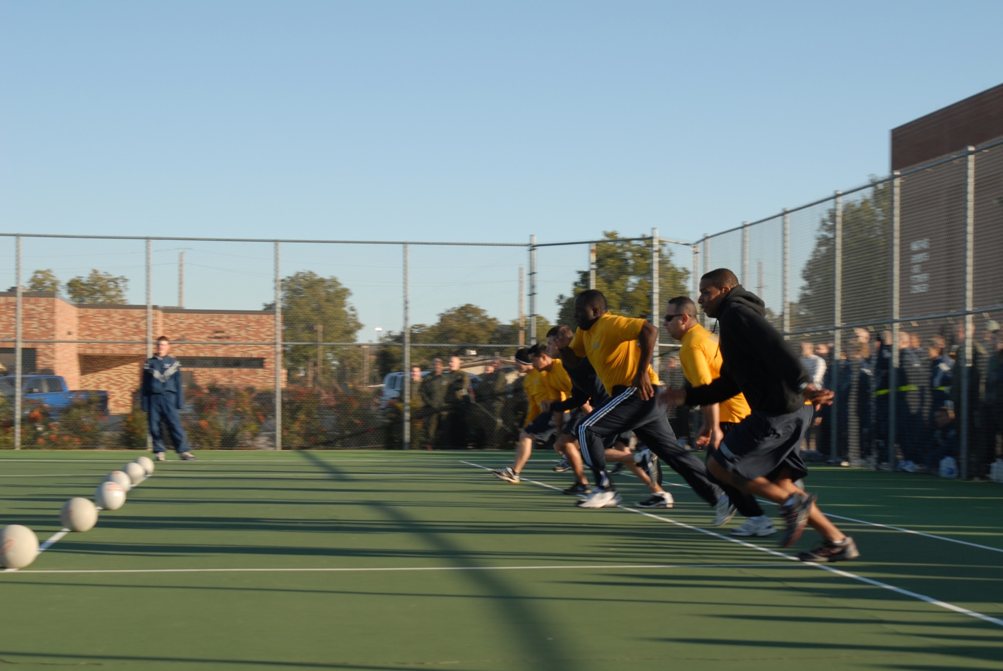 GOODFELLOW AIR FORCE BASE, Texas -- Navy Sailors kick-off the dodge ball game during a wing sports day event, Oct. 23, 2009. Sports day provided a variety of activities for all personnel including volleyball, badminton, dodge ball and more. (U.S. Air Force photo/Staff Sgt. Laura R. McFarlane)