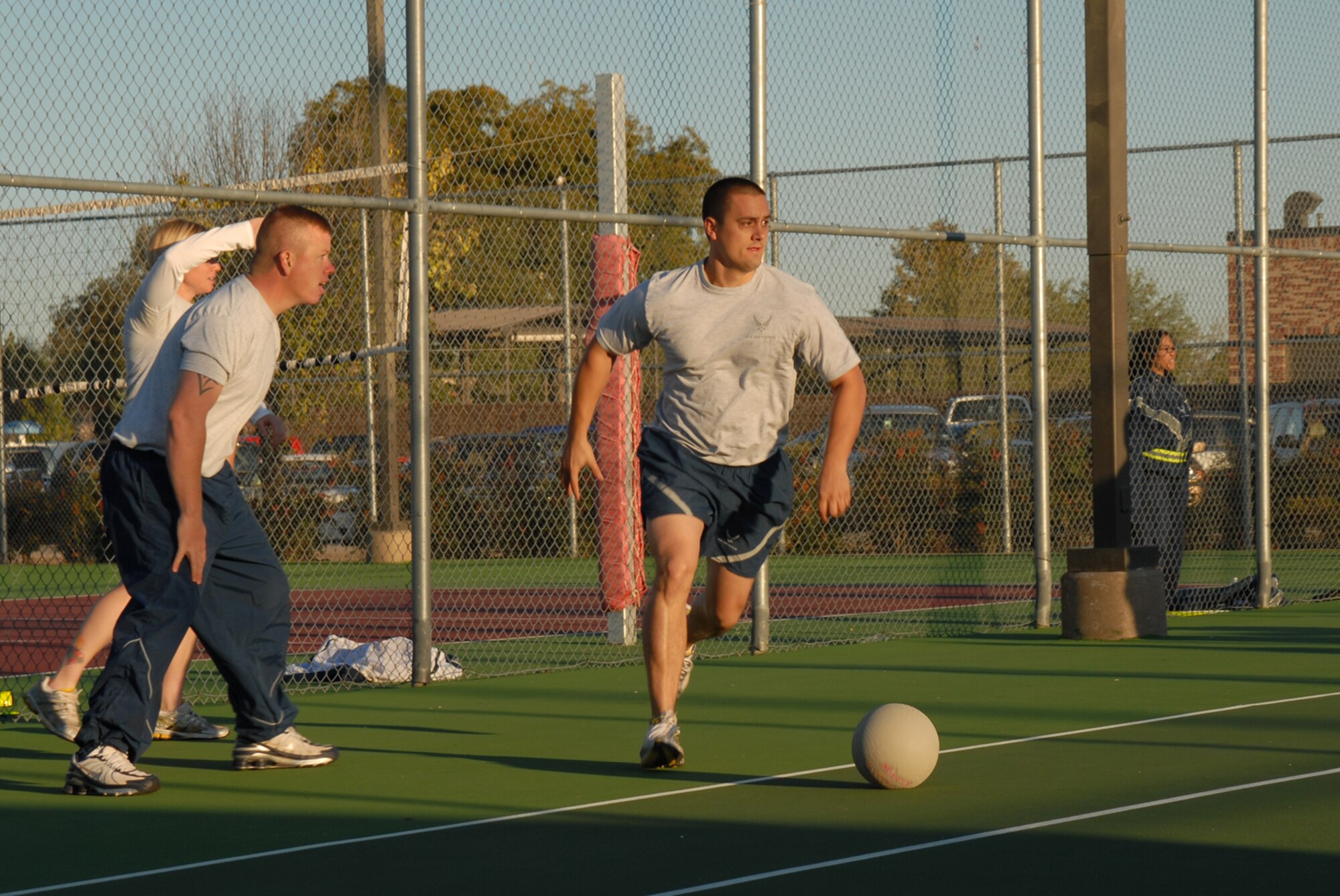 GOODFELLOW AIR FORCE BASE, Texas -- Staff Sgt. Chase Blevins, 17th Security Forces Squadron, runs to grab the ball during a game of dodge ball at a wing sports day event, Oct. 23, 2009. Sports day provided a variety of activities for all personnel including volleyball, badminton, dodge ball and more. (U.S. Air Force photo/Staff Sgt. Laura R. McFarlane)