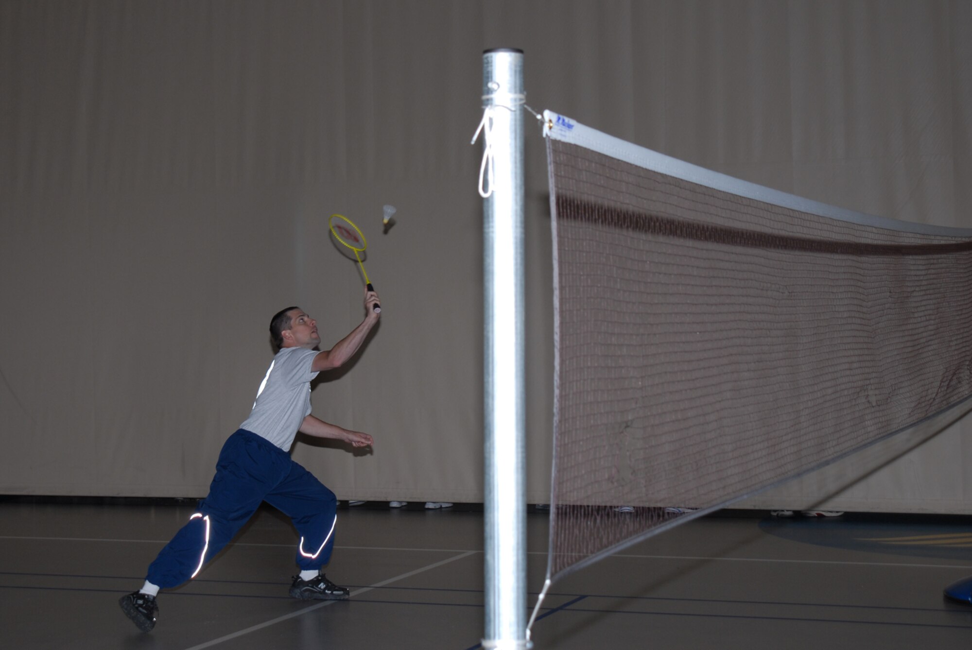 GOODFELLOW AIR FORCE BASE, Texas -- Staff Sgt. Victor Hyde swings at the birdie during a badminton match at a wing sports day event, Oct. 23, 2009. Sergeant Hyde is assigned to the 110th Air Intelligence Squadron, Michigan Air National Guard, and is currently stationed at Goodfellow as a student in the 315th Training Squadron. Sports day provided a variety of activities for all personnel including volleyball, badminton, dodge ball and more. (U.S. Air Force photo/Staff Sgt. Laura R. McFarlane)