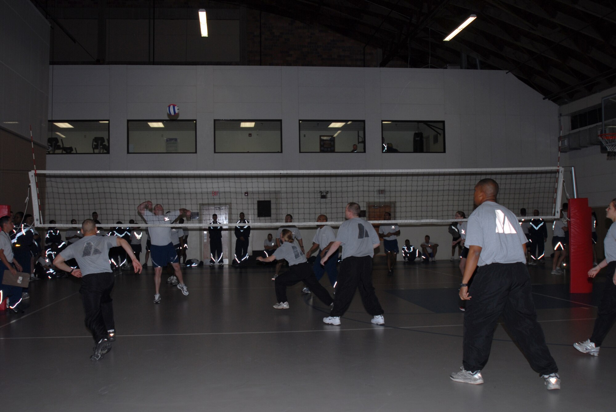 GOODFELLOW AIR FORCE BASE, Texas -- Airmen from the 17th Training Wing Staff Agencies compete against Soldiers from the 344th Military Intelligence Battalion during a volleyball game at a wing sports day event, Oct. 23, 2009. Sports day provided a variety of activities for all personnel including volleyball, badminton, dodge ball and more. (U.S. Air Force photo/Staff Sgt. Laura R. McFarlane)
