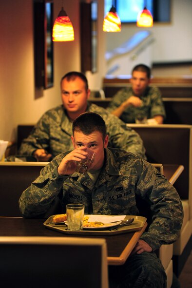 OFFUTT AIR FORCE BASE, Neb. - Airman 1st Class Raymond Nichols, 55th Maintenance Squadron, enjoys his lunch at the Ronald L. King Dining Facility here Oct. 22. The King Dining Facility serves more than 17,000 meals a month providing food for Offutt's warriors. Air Combat Command's Hennessy Inspection Team visits Offutt Nov. 1 - 4 to evaluate the King Dining Facility and the Campsisi Dining Facility as they compete for the prestigious Hennessy Award, an honor that recognizes the best Dining Facility Program in the Air Force. U.S. Air Force Photo by Josh Plueger