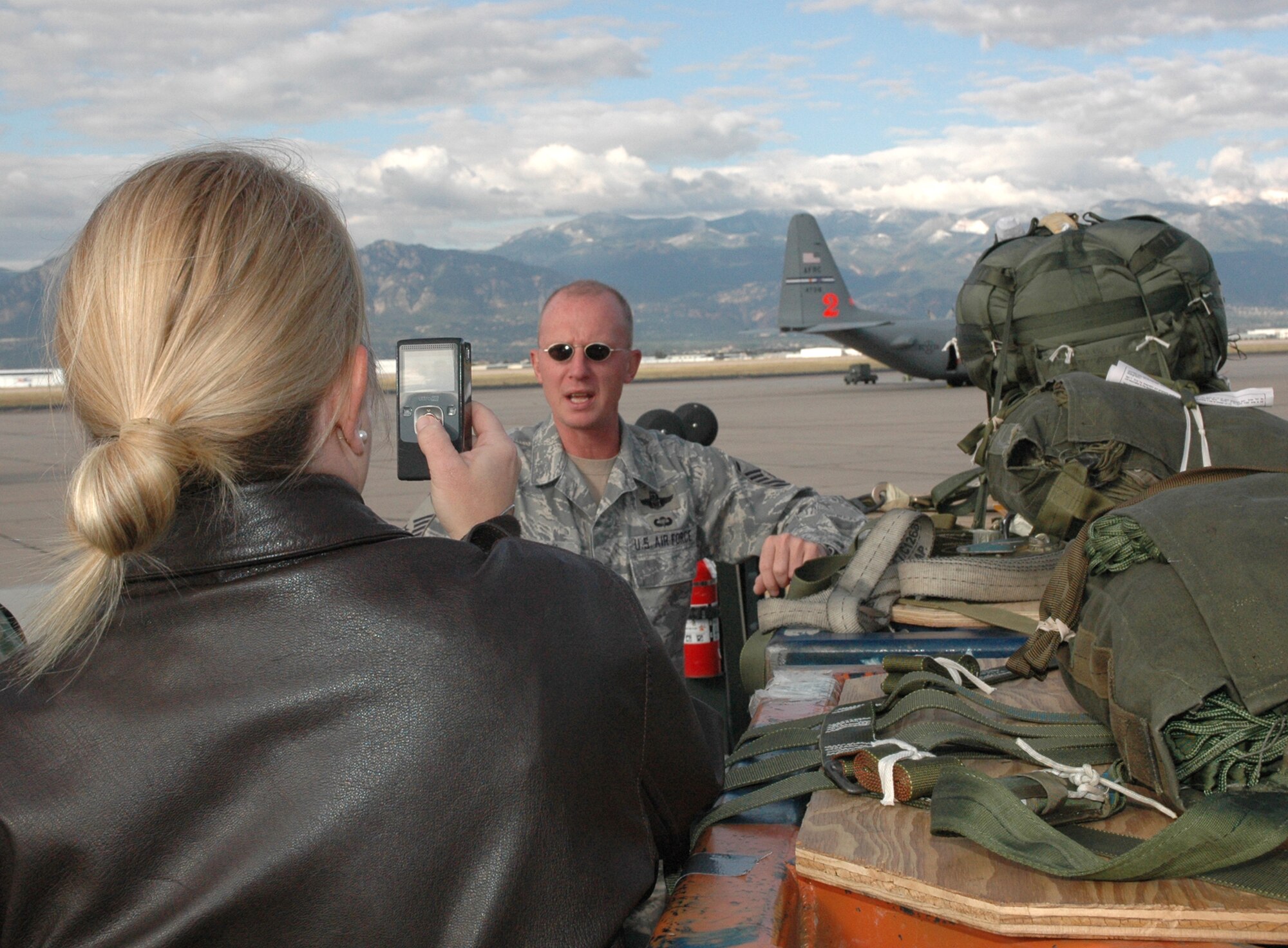 Master Sgt. Tom Freeman, a 731st Airlift Squadron loadmaster, provides a recorded interview with U.S. Air Force Academy personnel Sept. 24 before a simulated container delivery system drop at Fort Carson, Colo. The CDS drop, supported by a C-130 Hercules crew from the Air Force Reserve's 302nd Airlift Wing, supported the USAFA's Airdrop Enhanced Logistics Visibility System prototype system that demonstrated the ability of commanders in the field and at the headquarters level to simultaneously identify the location and contents of a CDS within minutes of the cargo leaving the aircraft. The AELVIS program aims to provide war fighters in locations like Iraq and Afghanistan with exact details on crucial cargo drops for resupply. (U.S. Air Force photo/Capt. Jody L. Ritchie)
