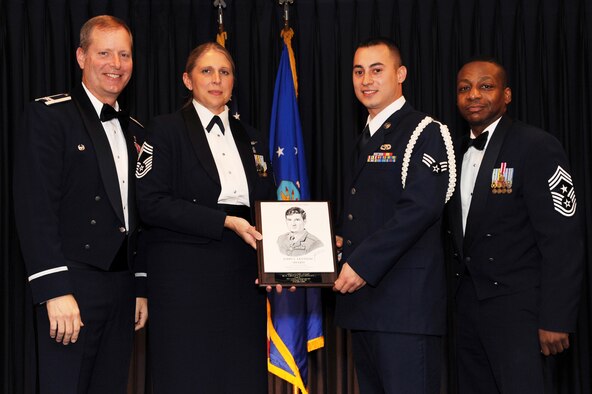 Senior Airman Ashley Haldeman, 19th Aircraft Maintenance Squadron electronics environmental systems apprentice, receives the John Levitow Award from base leaders during the Airman Leadership Class 10-1 graduation ceremony Oct. 22 at Hangar 1080. The Levitow Award is presented to the top graduate of each ALS class. (U.S. Air Force Photo by Senior Airman Jim Araos)