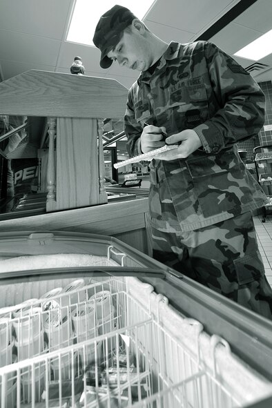 OFFUTT AIR FORCE BASE, Neb., -- Senior Airman Timothy Shaffer, 55th Force Support Squadron, takes a quick inventory of frozen food items at the Ronald L. King Dining Facility here Oct. 22. The King Dining Facility serves more than 17,000 meals a month providing food for Offutt's warriors. Air Combat Command's Hennessy Inspection Team visits Offutt Nov. 1 - 4 to evaluate the King Dining Facility and the Campsisi Dining Facility as they compete for the prestigious Hennessy Award, an honor that recognizes the best Dining Facility Program in the Air Force. U.S. Air Force Photo by Charles Haymond