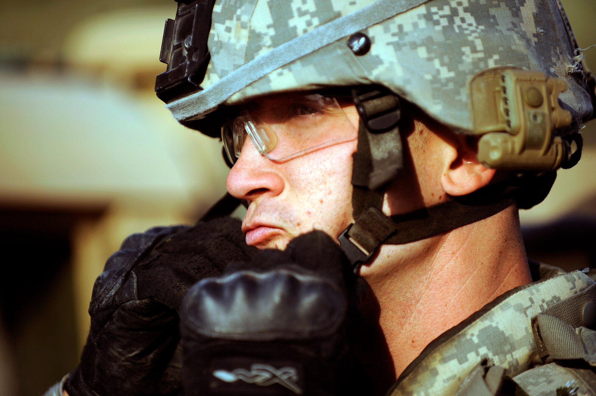 Staff Sgt. Justin Rush secures his helmet prior to a force protection patrol Oct. 17, 2009, outside Joint Base Balad, Iraq. Members of the 532nd Expeditionary Security Forces Squadron patrol to provide a security presence intended to deter anyone who would do harm to the people who live and work at the base. Sergeant Rush is assigned to the 532nd ESFS. (U.S. Air Force photo/Staff Sgt. Michael B. Keller) 
