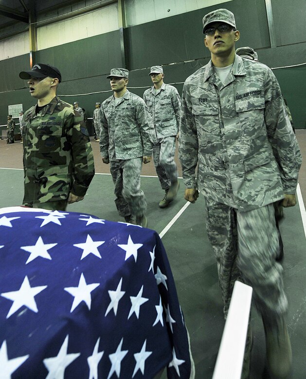 OFFUTT AIR FORCE BASE, Neb., -- Staff Sgt. Aaron Molchak (left), 55th Force Support Squadron, shouts marching orders to honor guard members from Offutt, as well as other Air Force installations during an Air Force Honor Guard training session at the Martin Bomber Building here Oct. 21. The Air Force Honor Guard visited Offutt to evaluate and help sharpen the skills of honor guard members from Offutt and other bases.
U.S. Air Force Photo by Charles Haymond