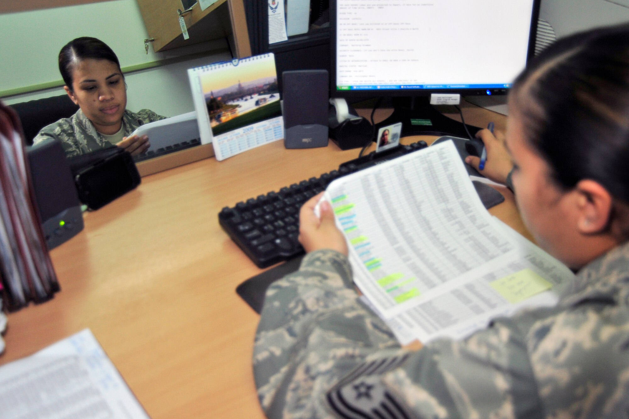 SOUTHWEST ASIA -Tech. Sgt. Claudia Moody, 380th Expeditionary Force Support Squadron, reads through a personnel list Oct. 27, 2009. Sergeant Moody is deployed from Robins Air Force Base, Texas, and hails from the U.S. Virgin Islands. (U.S. Air Force photo/Tech. Sgt. Charles Larkin Sr)
