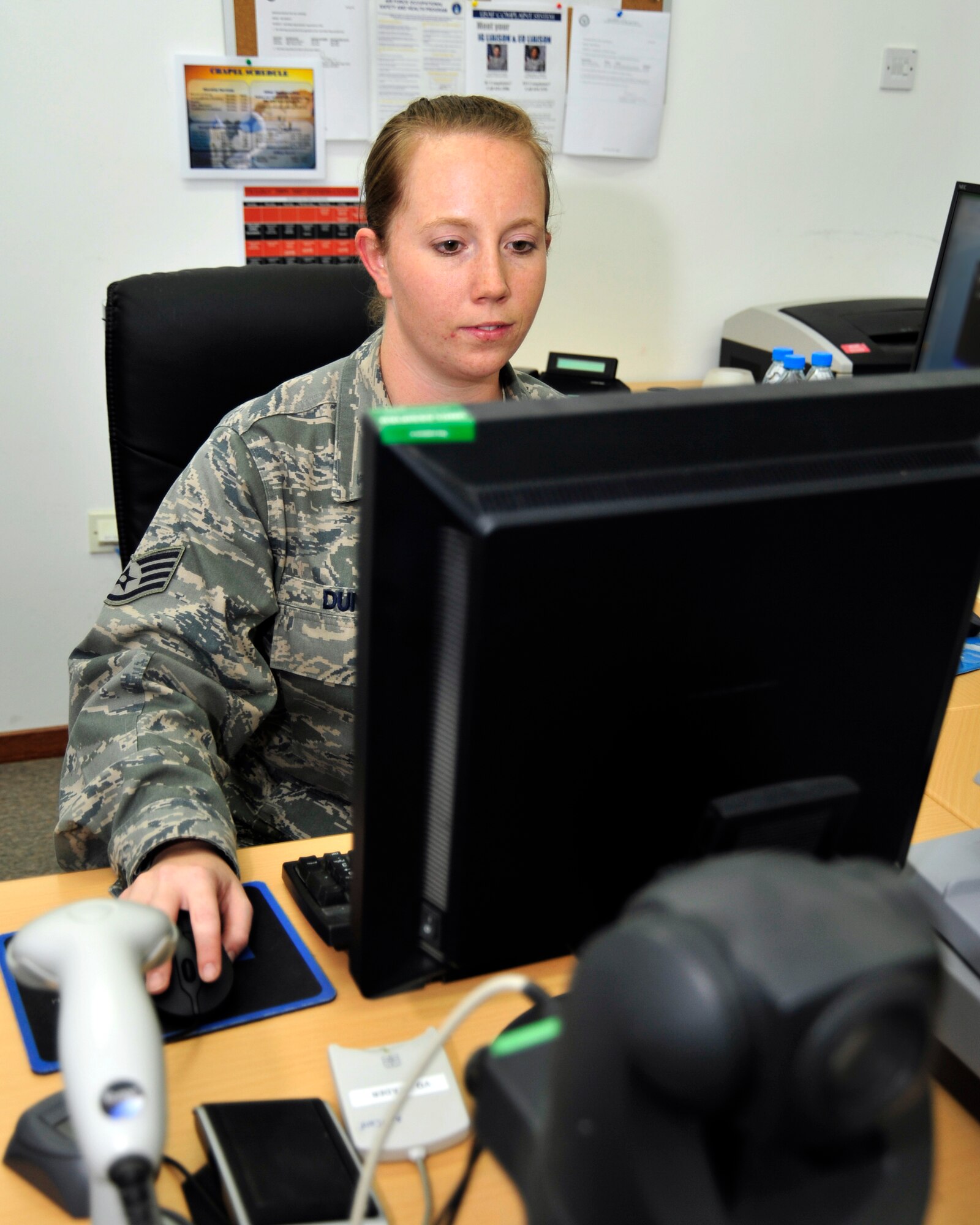 SOUTHWEST ASIA -Staff Sgt. Sabre Dunn, 380th Expeditionary Force Support Squadron, prepares to take a photograph for a military identification card Oct. 27, 2009. Sergeant Dunn is deployed from Robins Air Force Base, Texas, and hails from Cordova, S.C. (U.S. Air Force photo/Tech. Sgt. Charles Larkin Sr)
