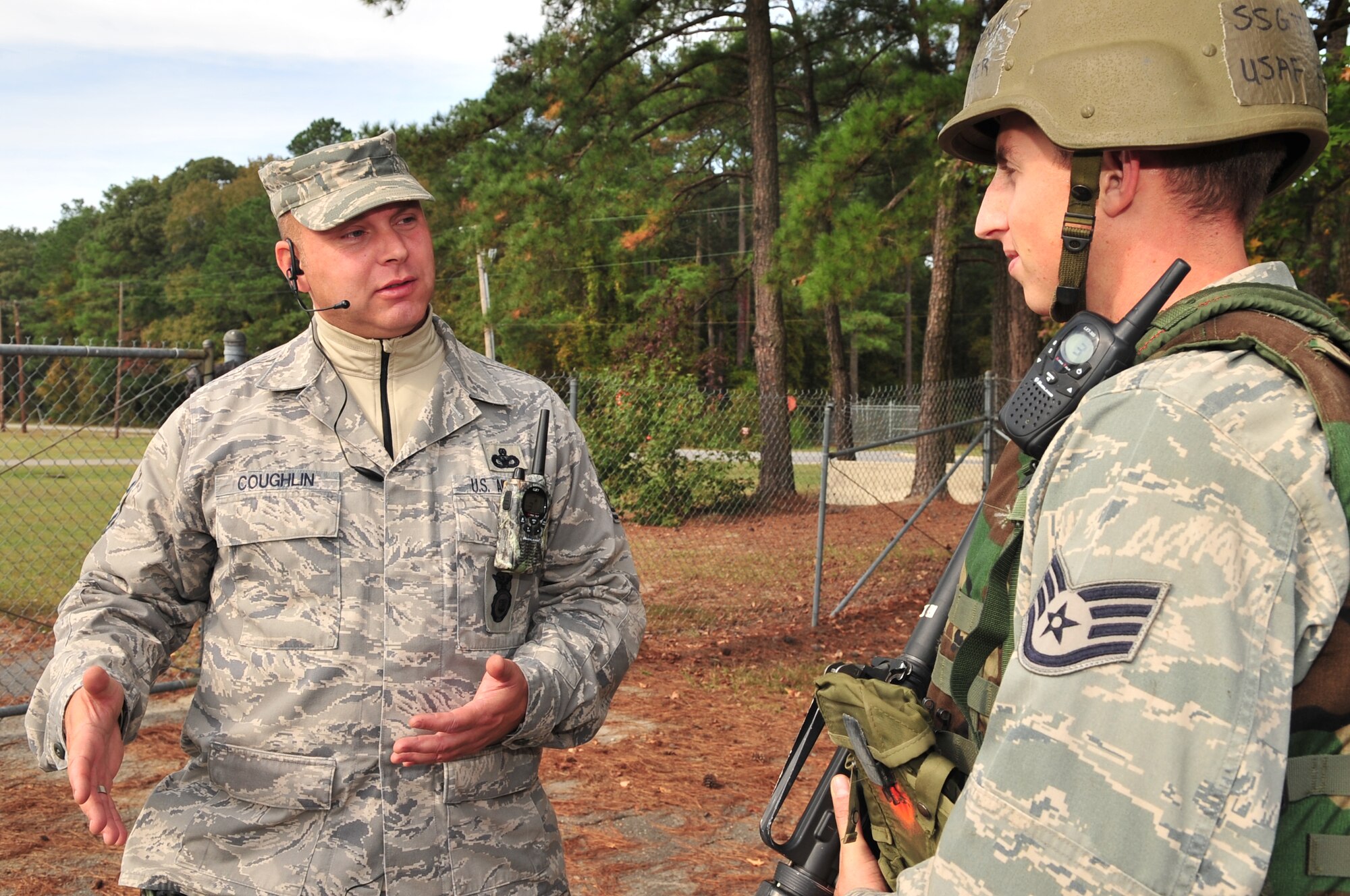 Master Sgt. Corey Coughlin, 4th Security Forces Squadron expeditionary combat skills training program manager, debriefs Staff Sgt. Anthony Fletcher, 4th Civil Engineer Squadron utilities systems journeyman, on the approach used against a simulated tribal chief during ECST at Seymour Johnson Air Force Base, N.C., Oct. 22, 2009. Airmen are debriefed after each scenario on actions completed correctly and incorrectly to prepare them for the next event. (U.S. Air Force photo/Airman 1st Class Rae Perry)